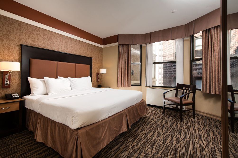 Preparar un viaje a Nueva York habitación hotel at fifht avenue
